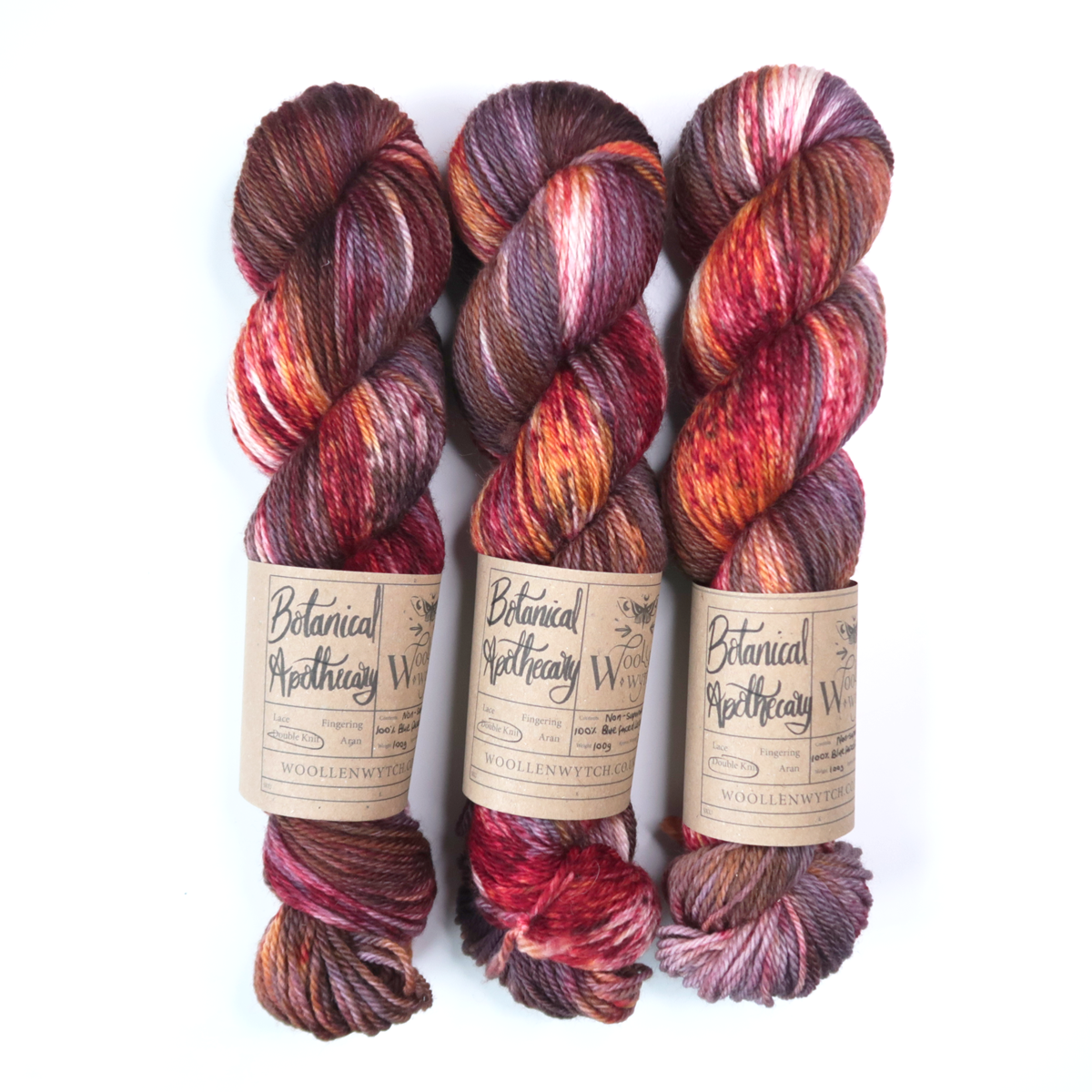 hand dyed yarn woollen wytch, botanical apothecary has red, purples and oranges blended through bfl yarn.