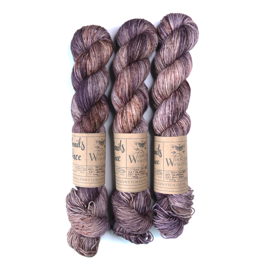 Hand dyed yarn using BFL british wool in Snails pace purples and browns by Woollen Wytch in bristol